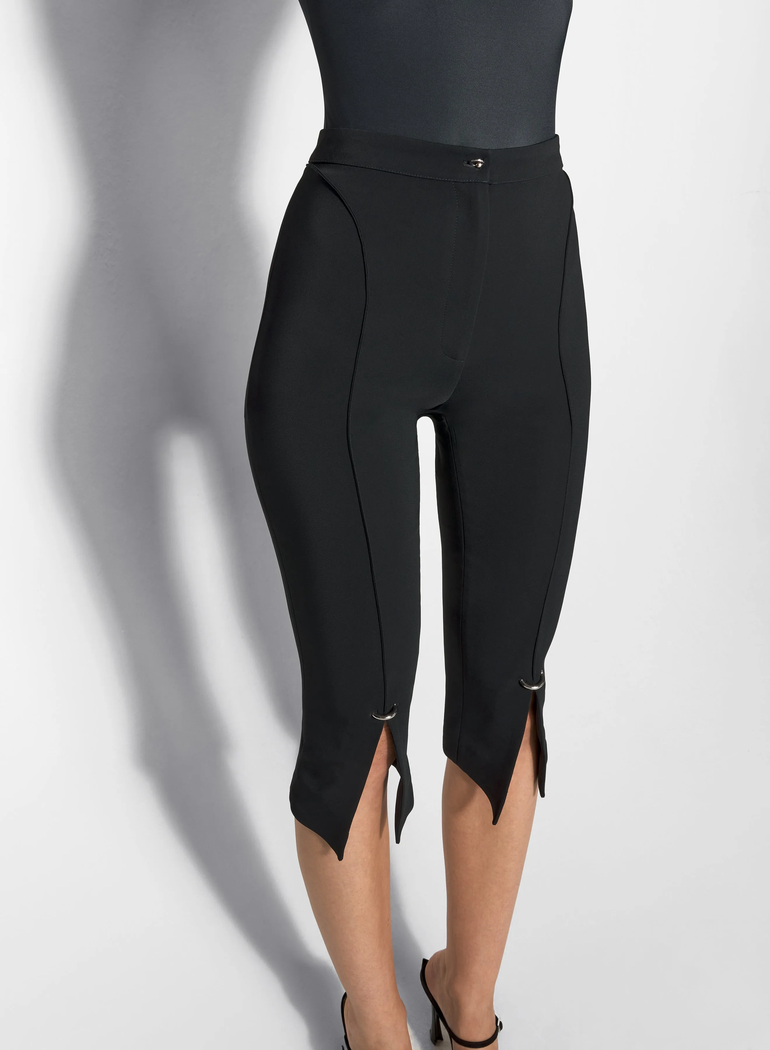 black pierced capri pants